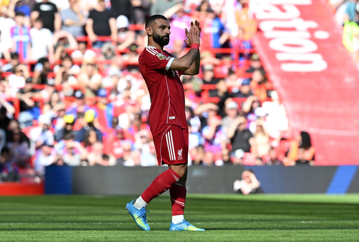 Mohamed Salah of Liverpool applauds the fans as he is substituted off after picking up an injury during the Premier League match between Liverpool and Crystal Palace