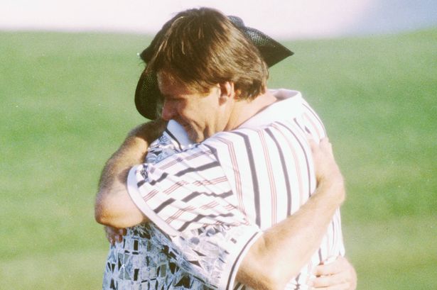 Greg Norman and Nick Faldo embrace
