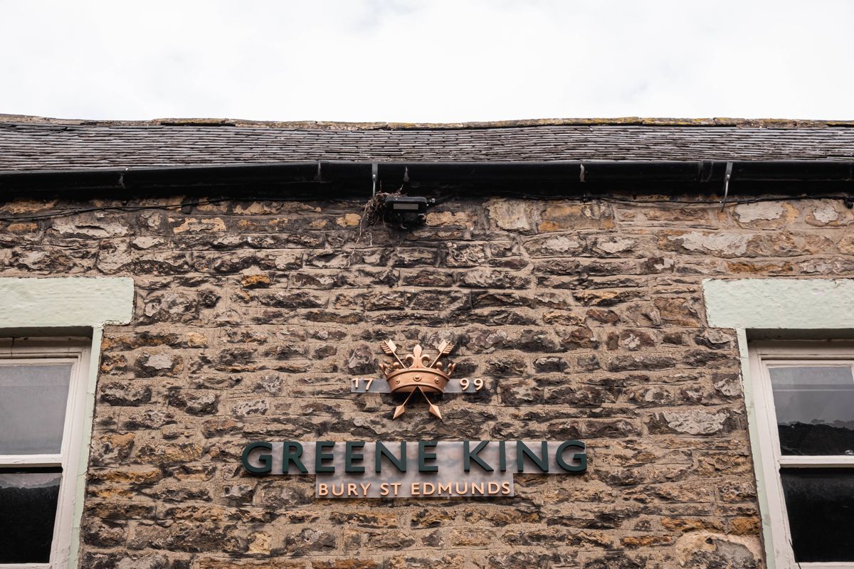 Corbridge, Northumberland, United Kingdom - February, 14, 2025: Greene King sign on building exterior. in Corbridge