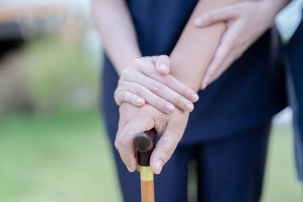 Home healthcare for asian female nurse give help female senior patient from bed at home. Asian female nurse and concept.