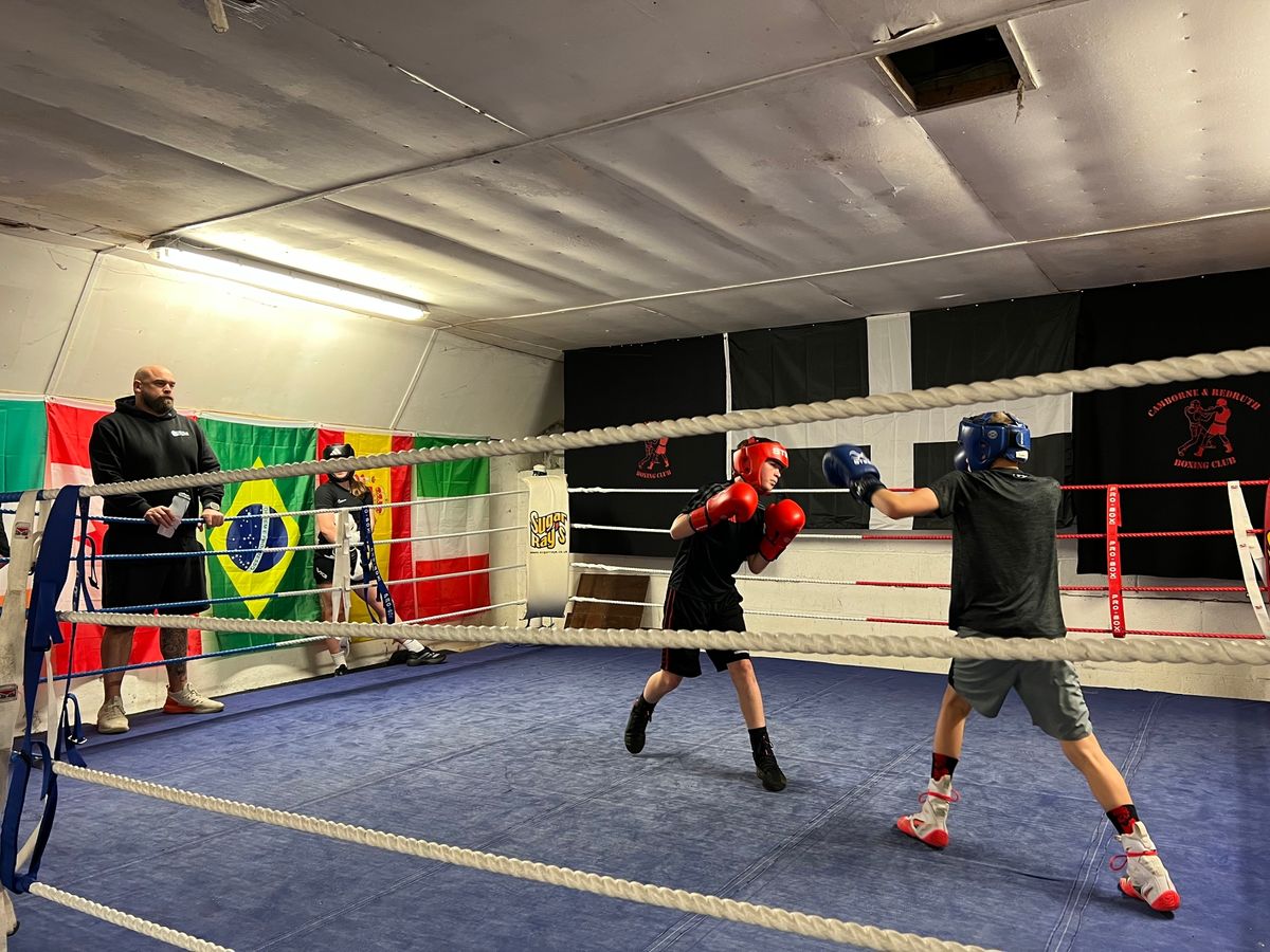 Boxers from other clubs spar with members of the Camborne and Redruth Amateur Boxing Club during an evening training session 