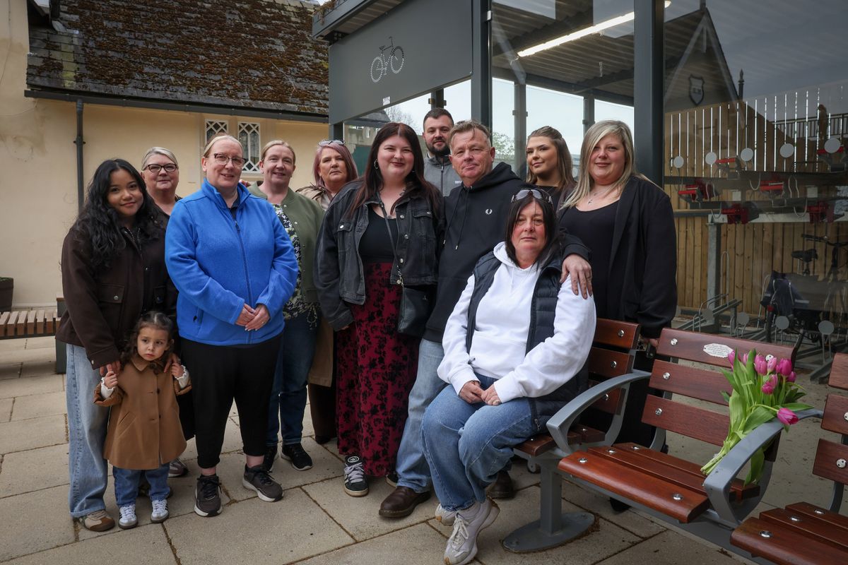 Friends and family pictured beside a plaque on a bench at Beeston Train Station in memory of Freddie Bennett.