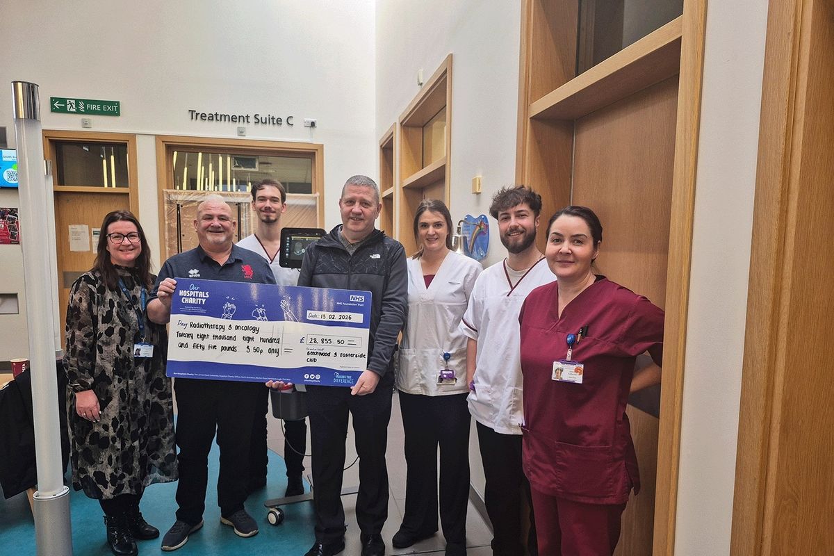 Mick and Harry make their donation to the radiotherapy team at The James Cook University Hospital