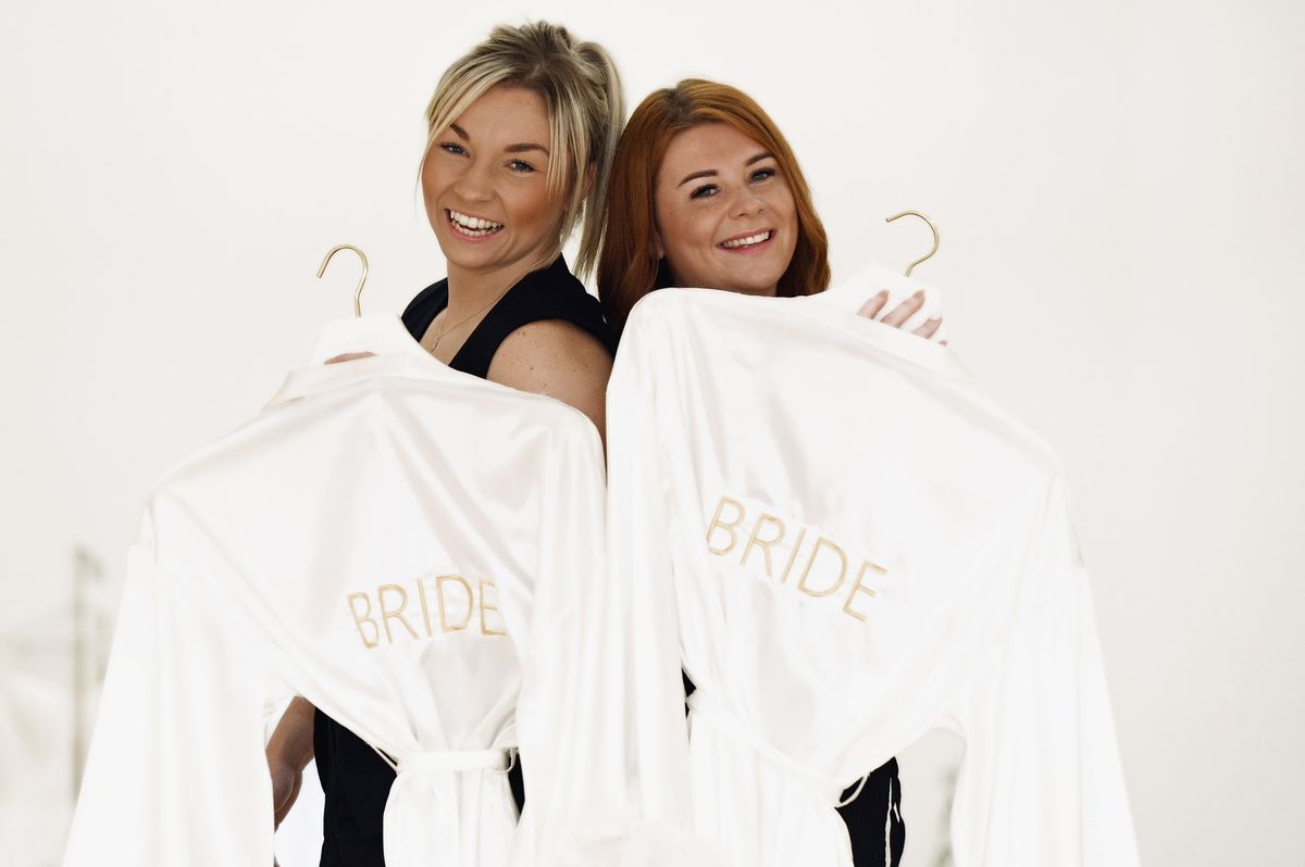 Boxer Lauren Price and her fiance Carlie Jones looking at wedding dresses at Eva Ashley, Cardiff city centre