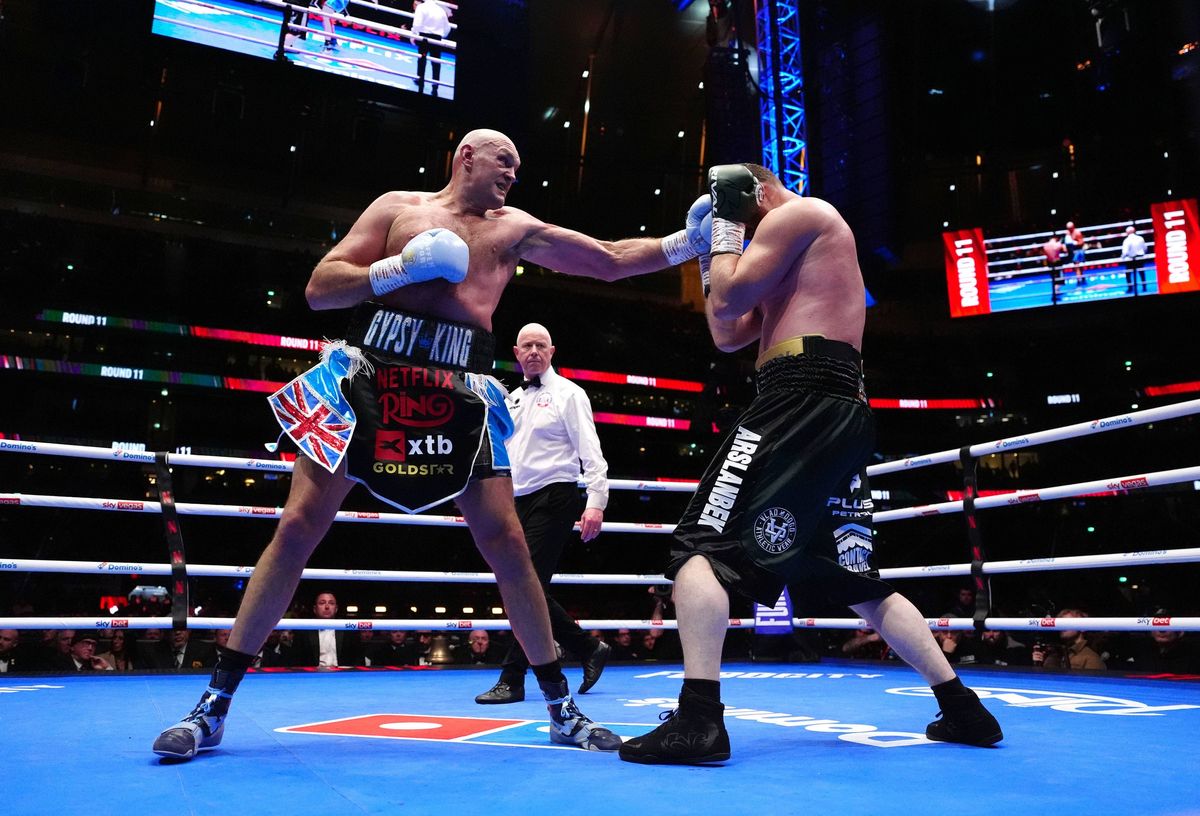 Tyson Fury (left) and Arslanbek Makhmudov in the heavy weight bout at Tottenham Hotspur Stadium, London. Picture date: Saturday April 11, 2026. PA Phot