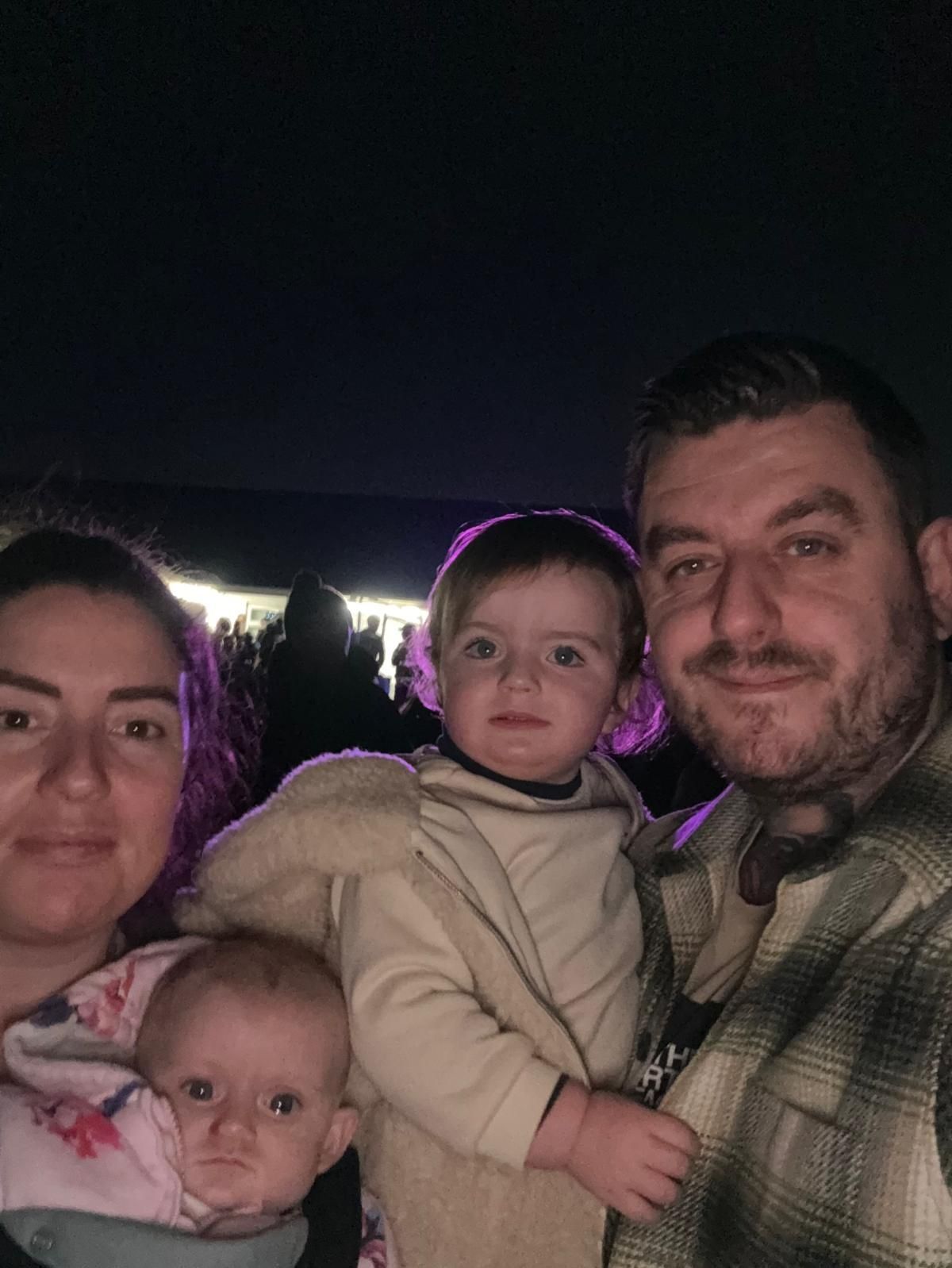 With mum Rebecca, dad Chris and sister Willow
