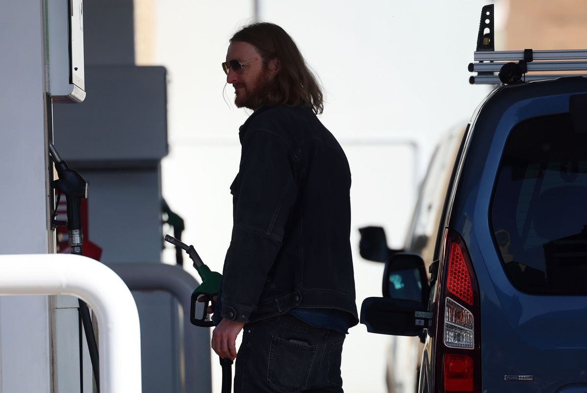 A motorist at a petrol pump