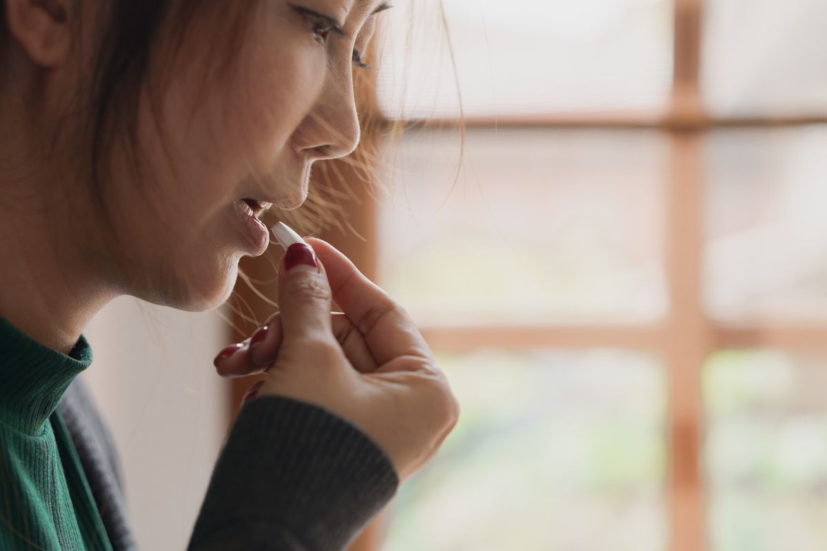 Person taking a pill