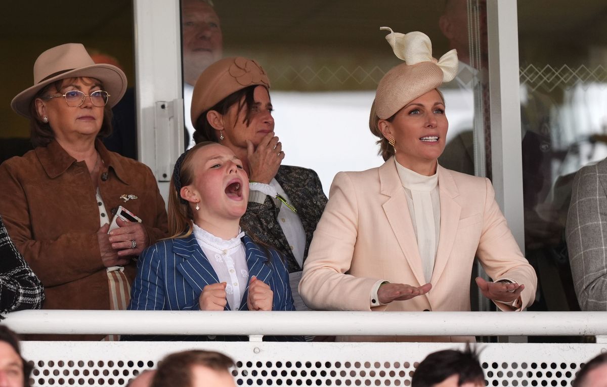 Mia roars on the horses at the Grand National Festival alongside mum Zara