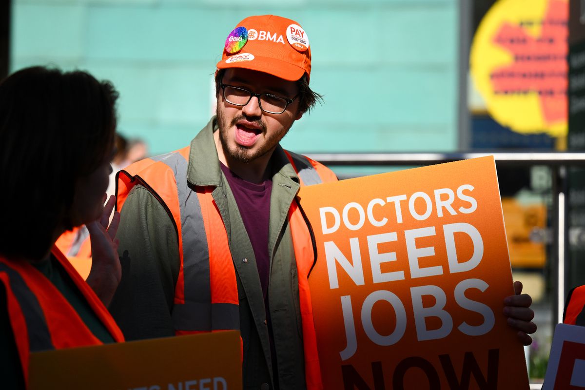 Resident doctors strike over pay and conditions on a picket line