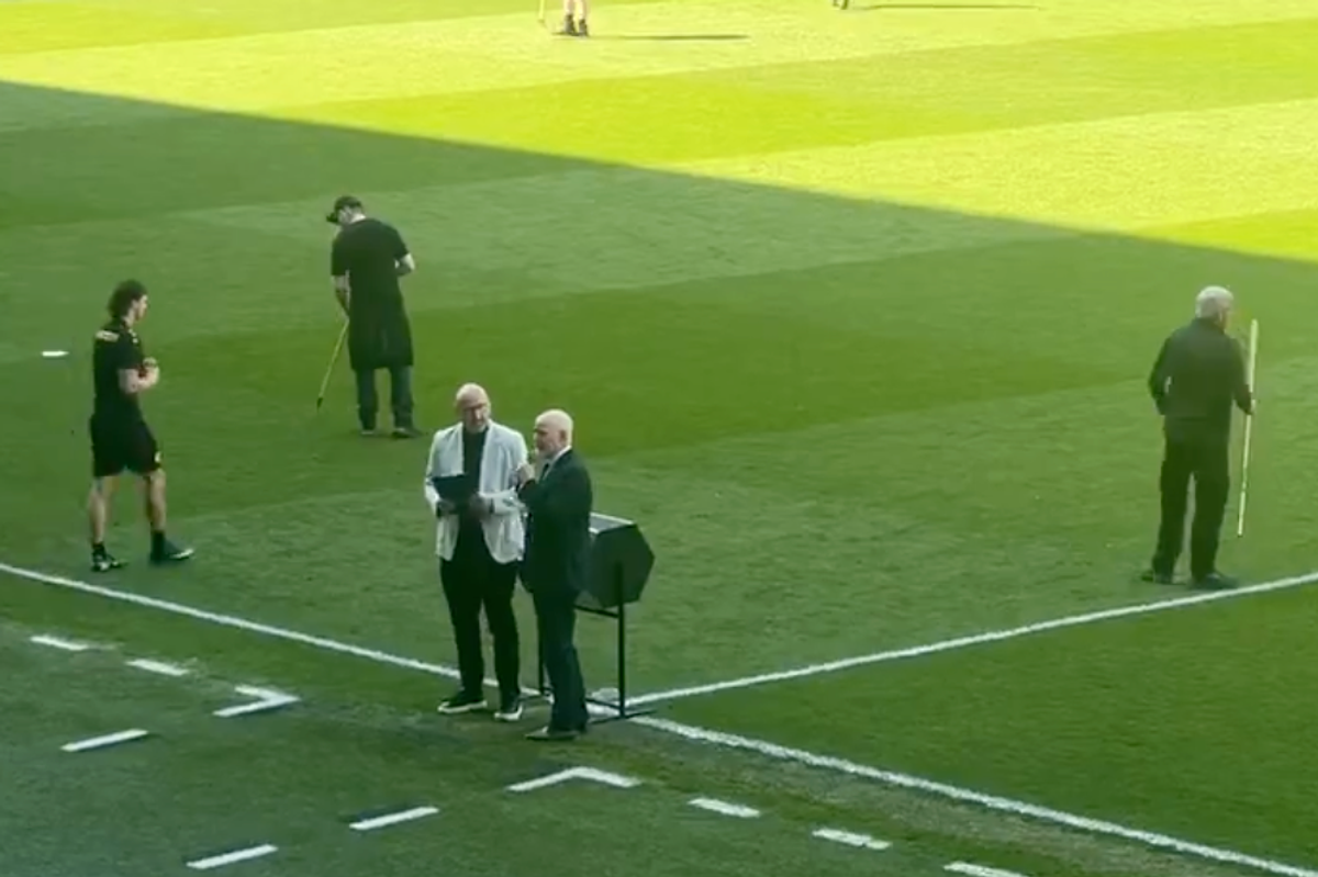 John Brown conducts the half-time draw at Ibrox