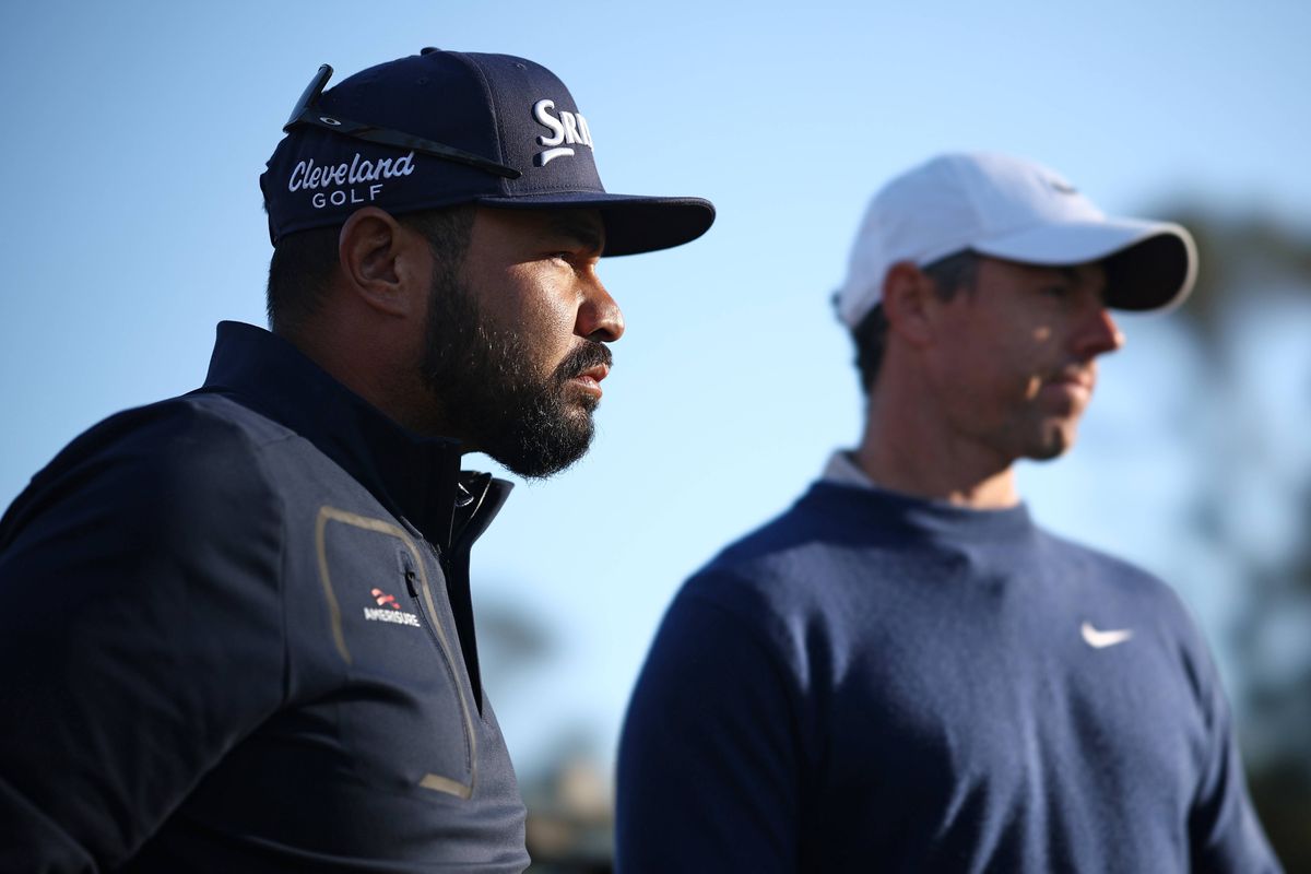 PONTE VEDRA BEACH, FLORIDA - MARCH 17: J.J. Spaun of the United States and Rory McIlroy of Northern Ireland look on from the 16th tee during the playoff in the final round of THE PLAYERS Championship on the Stadium Course at TPC Sawgrass on March 17, 2025 in Ponte Vedra Beach, Florida. (Photo by Jared C. Tilton/Getty Images)