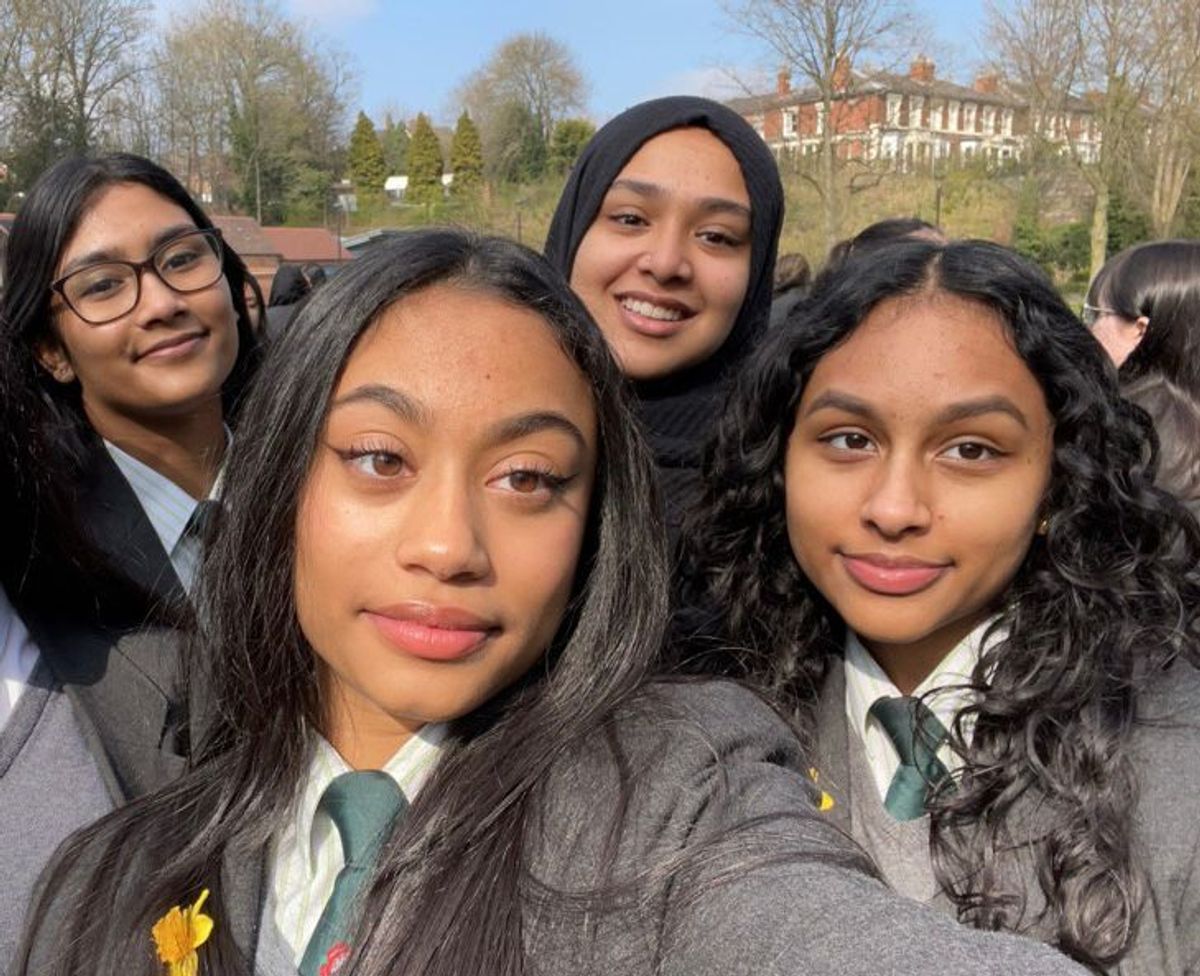 Tashifa (left) with schoolfriends before her diagnosis