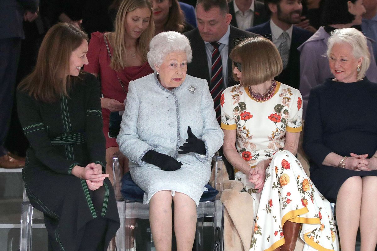 The late Queen at London Fashion Week with Dame Anna Wintour and Angela Kelly in 2018