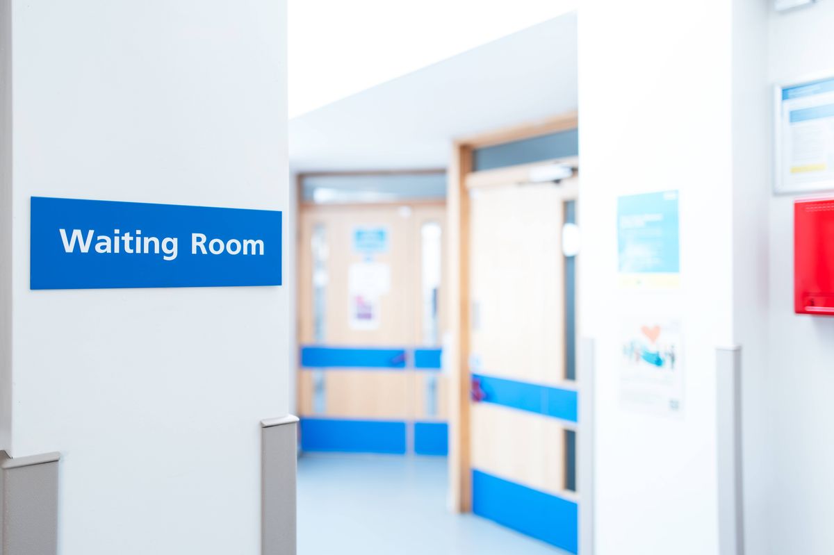 Typical British hospital and GP waiting room sign seen within a patient's medical waiting area