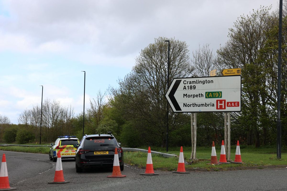 Police vehicles and cordon in place at the scene of a collision on the A189