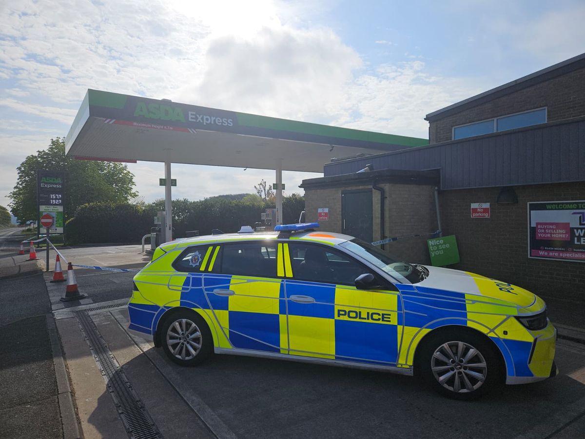 A cordon in place and police vehicles in attendance at Asda Express petrol station in Prudhoe on Sunday morning