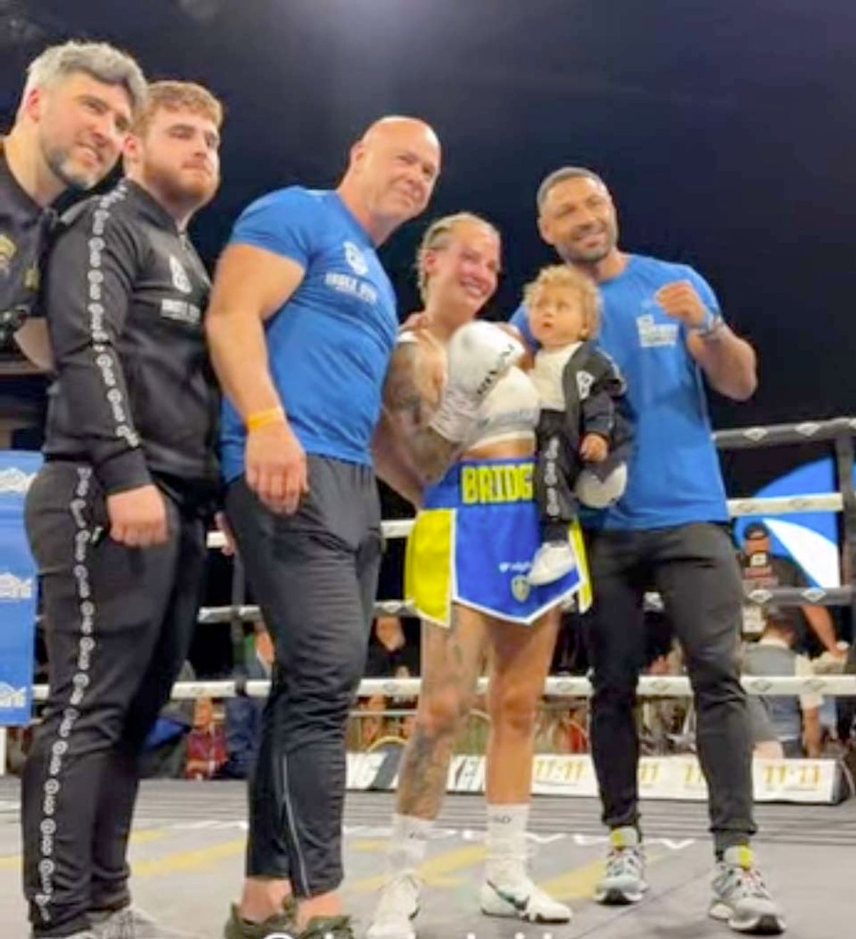 Ebanie Bridges celebrated with her team including partner Kell Brook, baby Ezerra and new trainer  Dominic Ingle after her win