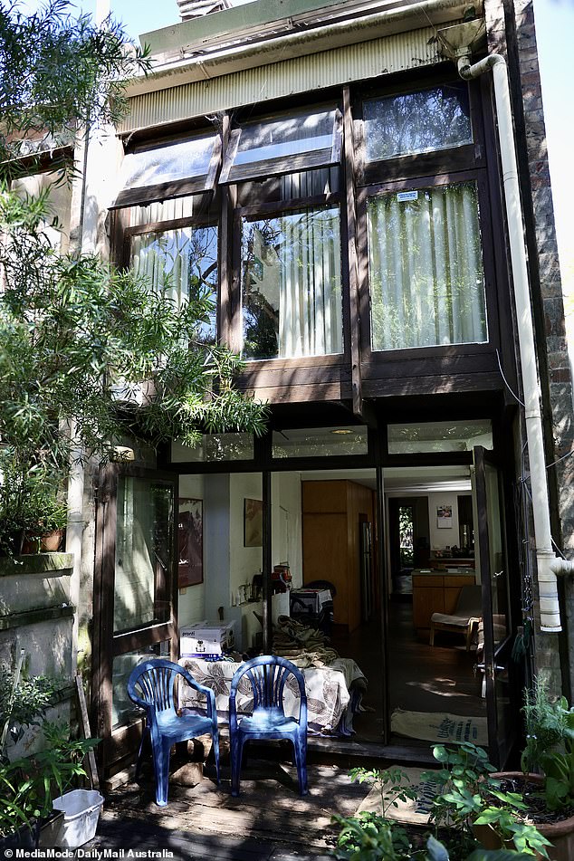 The home is a a three-bedroom terrace with classic balcony and small back garden