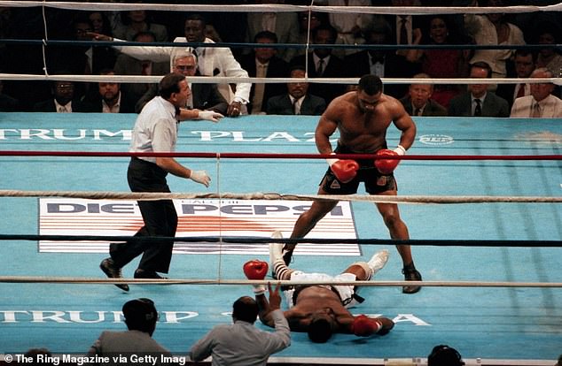 Mike Tyson knocks out Michael Spinks in 91 seconds in Atlantic City