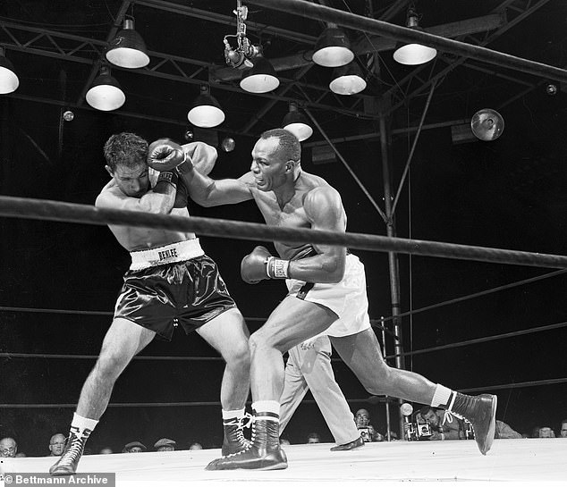 Rocky Marciano (left) takes a pounding from 'Jersey' Joe Walcott, before fighting back to knock out his opponent in the 13th round