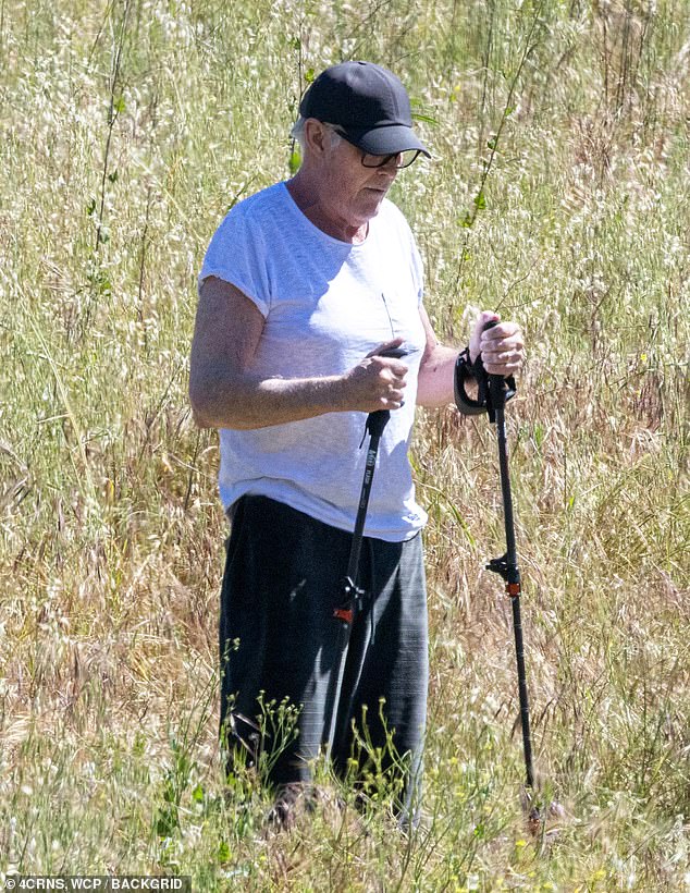 His once-dark hair was now mostly gray, and he covered it up with a black cap. He also wore a set of dark plastic-frame sunglasses