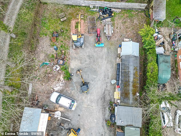 The couple said the delays have resulted in 'astronomical extra costs' - and they keep having to apologise to neighbours for the appearance of the land (pictured)