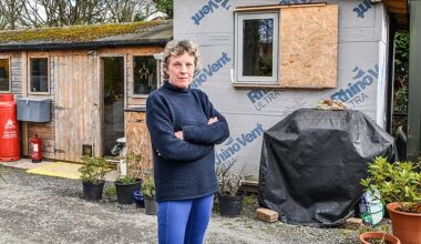 Jane Coyle, 64, and her husband Anthony, 67, submitted plans to build the three bedroom eco property in the village of Edwyn Ralph, Herefordshire, back in 2020. Pictured: Mrs Coyle outside the shed the couple have been forced to live in