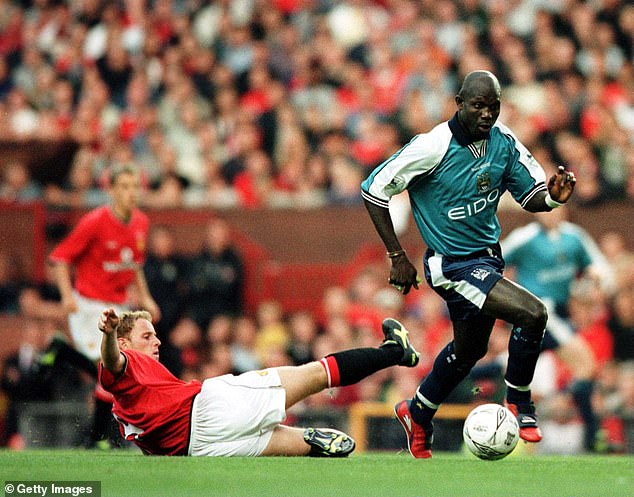 George Weah, Liberia's most famous player and ex-president, while playing for Manchester City during Denis Irwin's testimonial in 2000 - Irwin had to go off injured after a tackle by Weah