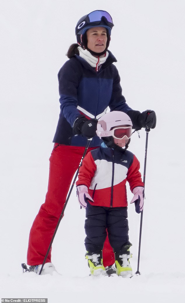 The girls were almost identically dressed in black ski trousers and red and white jackets with protective white helmets and wearing goggles