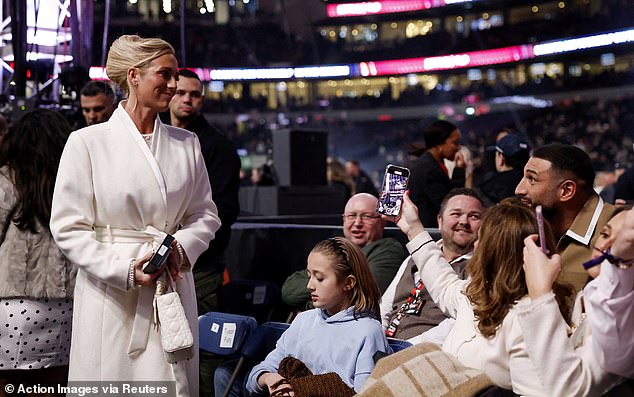 Paris seen heading to her seat at the packed stadium to watch her husband's fight