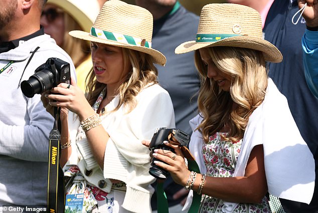 Patrons take photos during a practice round prior to the 2026 Masters Tournament at Augusta National Golf Club