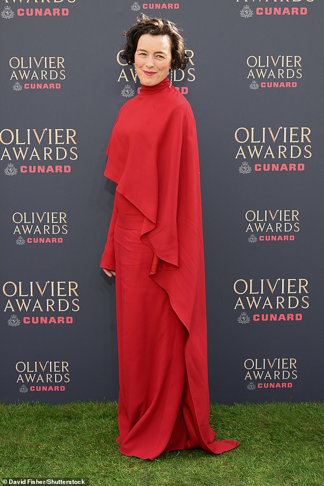 Olivia Williams looked chic in a red sweeping gown as she posed for the cameras
