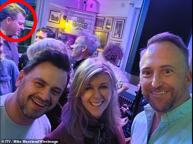 Out and about: Kate Garraway at The Railway Arms with Liam Halligan, circled. The pair were seen 'getting cosy' together