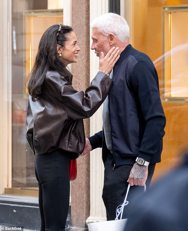 The businessman, 63, who is the younger brother of footballer turned presenter Gary, can be seen beaming in new snaps with a younger woman