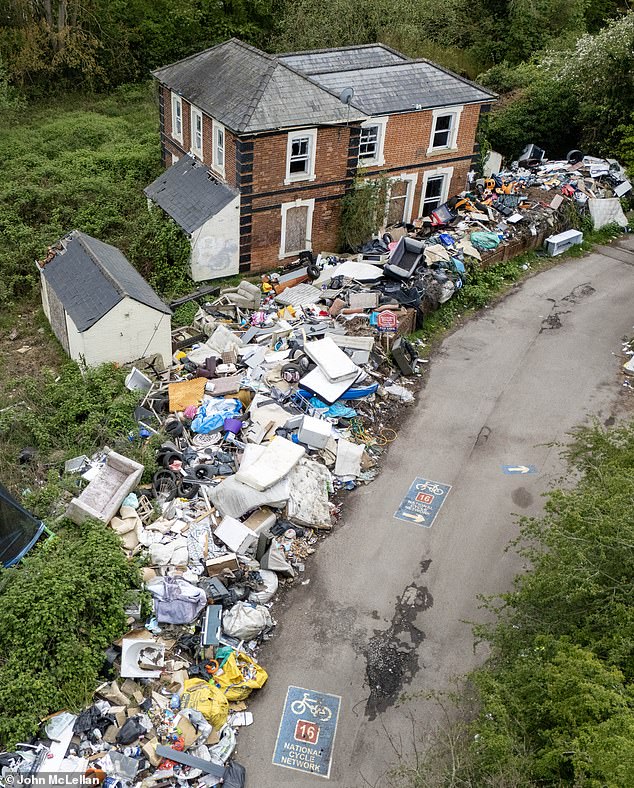 Items including furniture, packaging and fridges stretch for more than 80 metres on the site