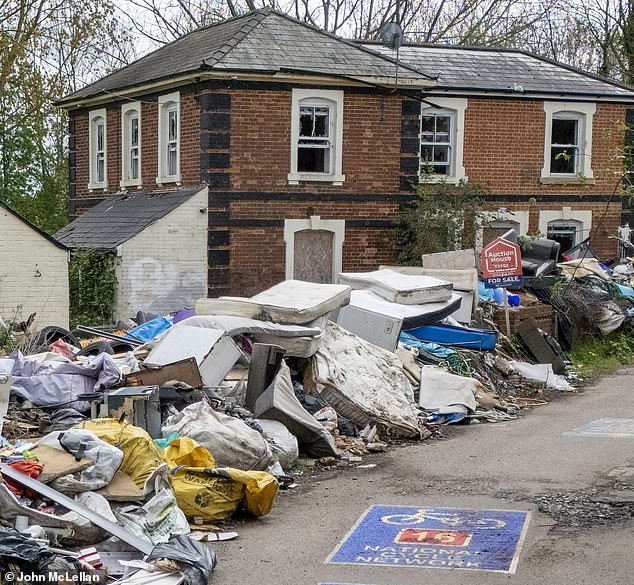 Fly-tippers have targeted former railway station near Dunmow in Essex (pictured) by dumping a five-foot wall of rubbish