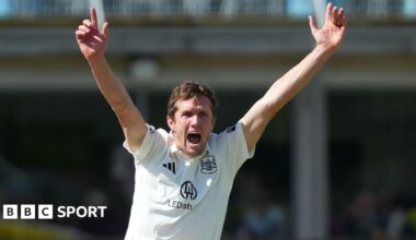 Will Williams with both hands aloft appealing for a wicket for Glocuestershire