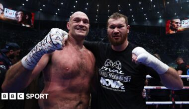 Tyson Fury and Arslanbek Makhmudov pose for photos in the ring