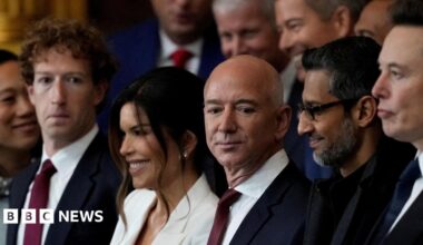 From left to right: Meta CEO Mark Zuckerberg wearing a navy suit, red neck tie and white dress shirt; Lauren Sanchez, wife of Amazon founder and former CEO Jeff Bezos, wearing a white blazer; Jeff Bezos, in a navy suit, red neck tie and white dress shirt; Google CEO Sundar Pichai, in an all black coat, shirt and tie.