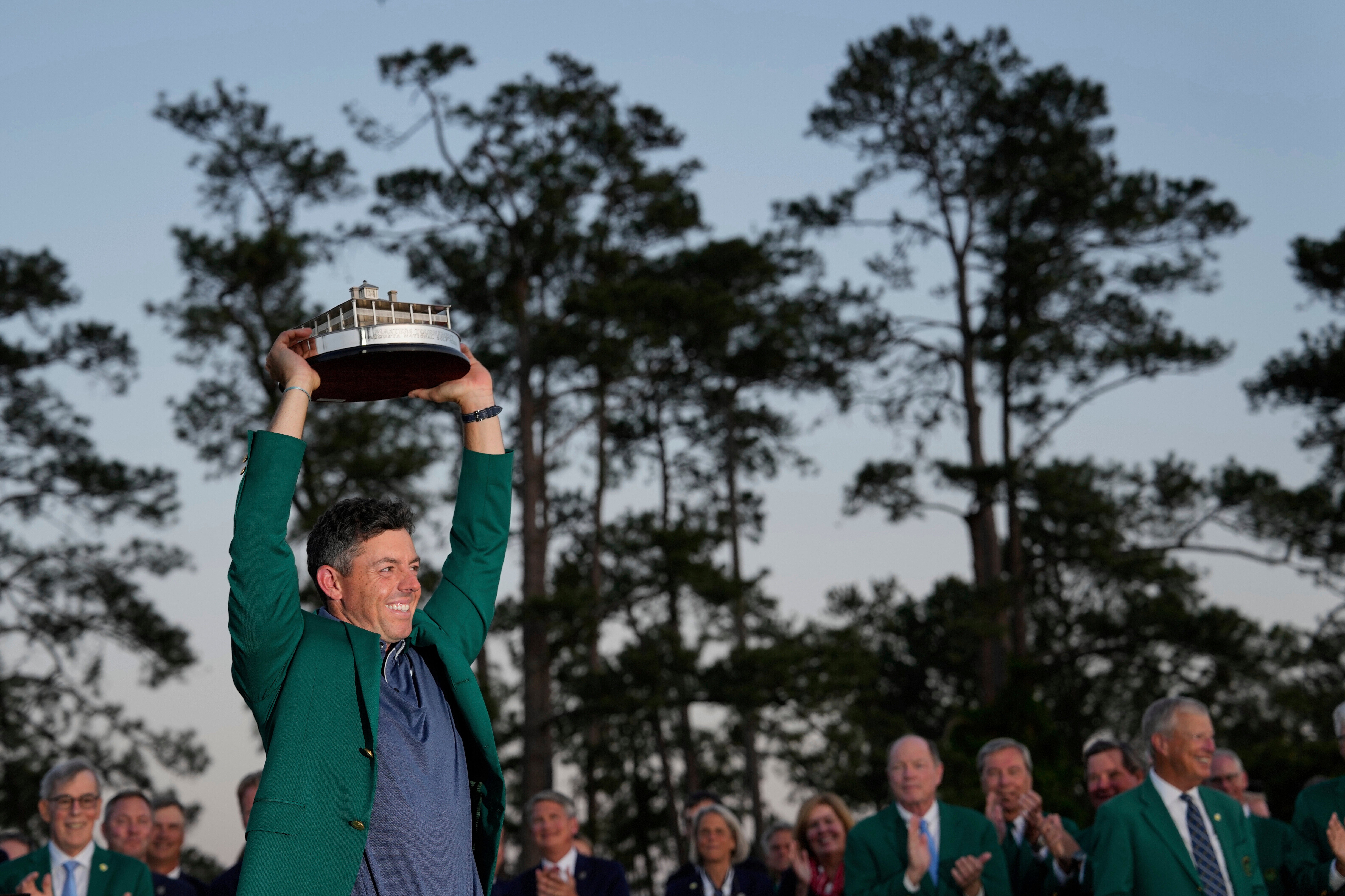 McIlroy lifts the trophy after finally winning The Masters