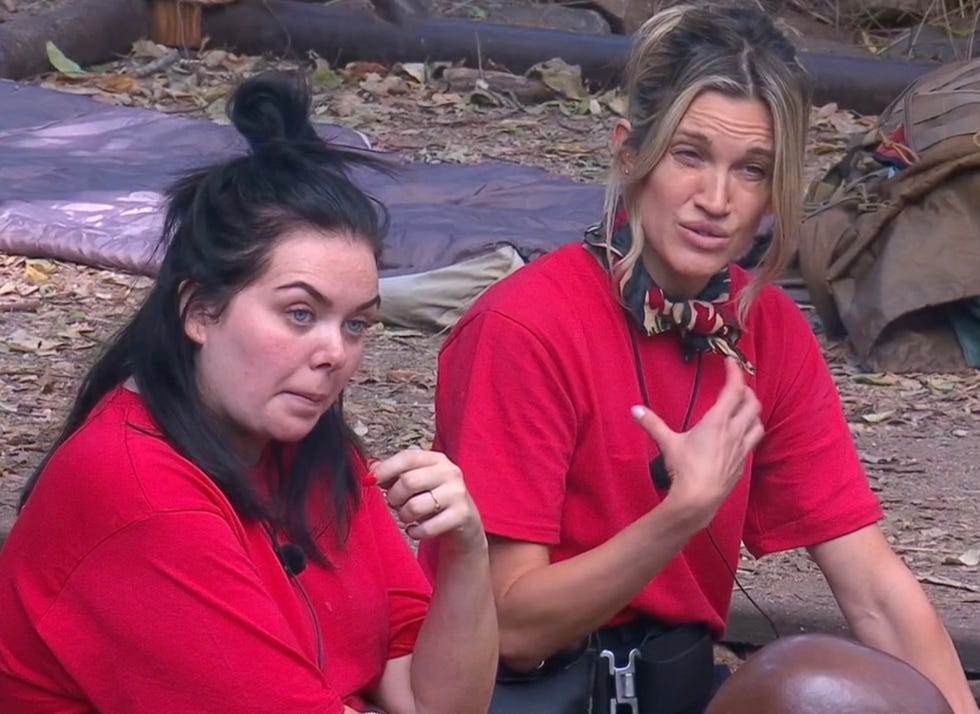 scarlett moffatt ashley roberts im a celeb two individuals in red shirts engaged in conversation