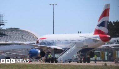 The side of a British Airways plane landing at Guernsey Airport.