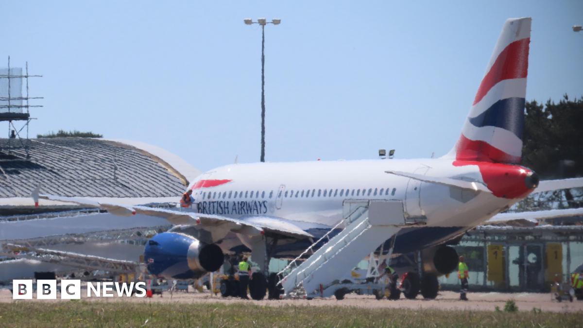 The side of a British Airways plane landing at Guernsey Airport.