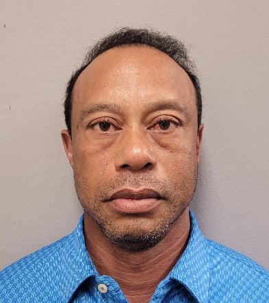 Tiger Woods poses for his booking photo after his arrest