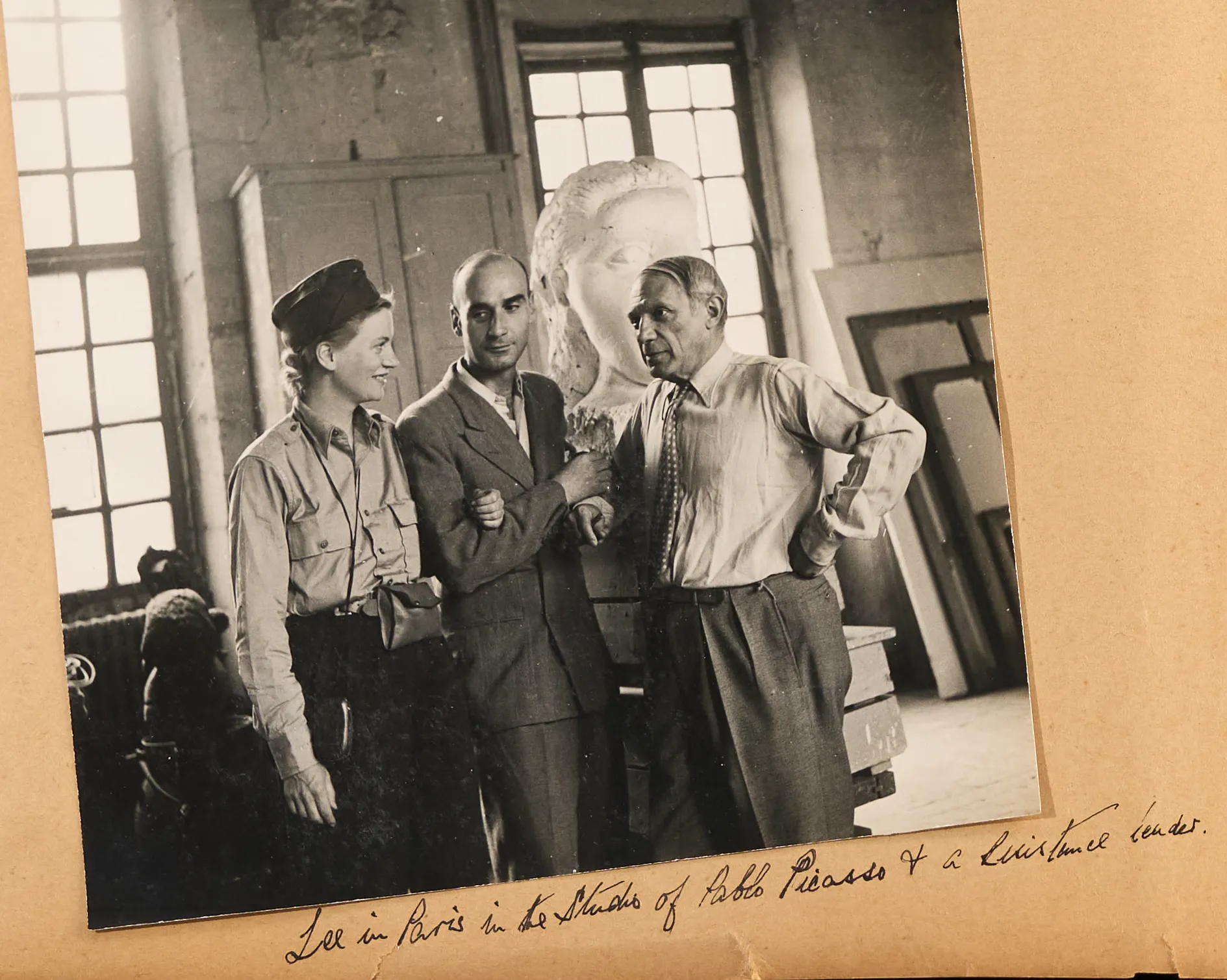 An open scrapbook containing several black and white photographs and handwritten notes from the "Miller – Beaton scrapbook" spanning 1943-1949.