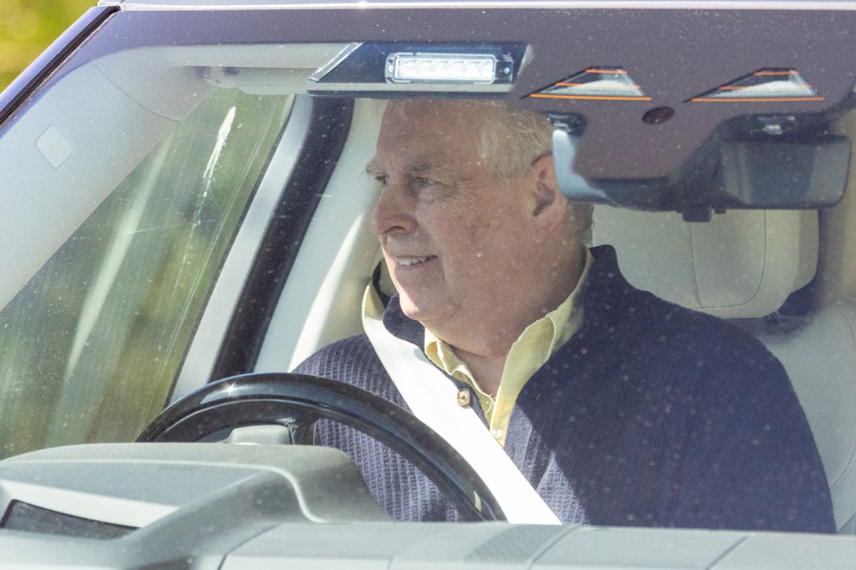 Disgraced royal Andrew in the driver's seat looking happy on the Sandringham estate
