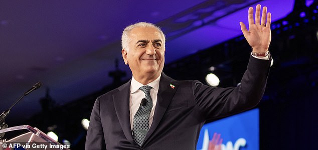 Iranian political activist Reza Pahlavi greets the crowd during the Conservative Political Action Conference (CPAC) in Grapevine, Texas, on March 28, 2026. American conservatives converge on Texas this week for what organizers bill as their largest and most influential gathering, with the Iran war and fears of a punishing midterm election cycle heightening the stakes. (Photo by Leandro Lozada / AFP via Getty Images)