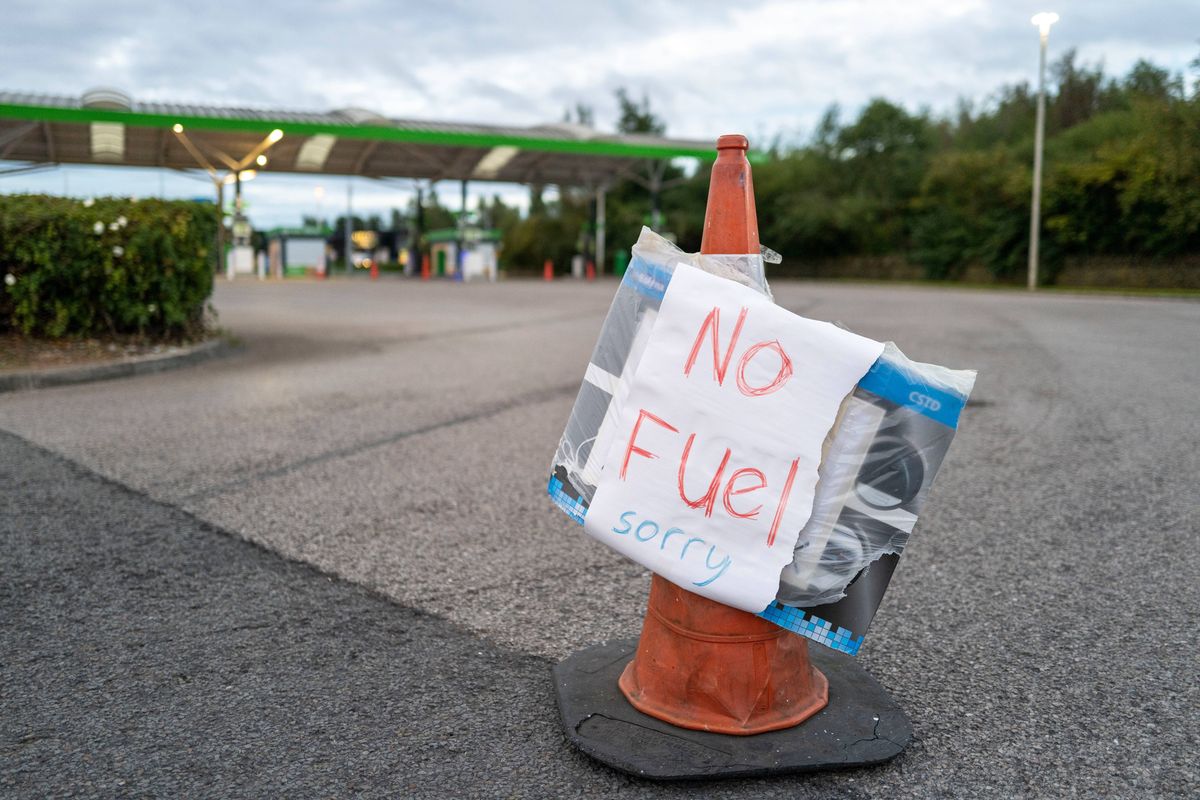 CARDIFF, WALES - SEPTEMBER 26: A sign that reads "No Fuel Sorry" is displayed at an ASDA petrol station on September 26, 2021 in Cardiff, United Kingdom. BP and Esso have announced that its ability to transport fuel from refineries to its branded petrol station forecourts is being impacted by the ongoing shortage of HGV drivers and as a result, it will be rationing deliveries to ensure continuity of supply. On Saturday the government announced plans to give temporary visas until Christmas Eve to 5,000 fuel tanker and food lorry drivers and 5,500 poultry workers in an attempt to limit disruption in the build up to Christmas. (Photo by Matthew Horwood/Getty Images)