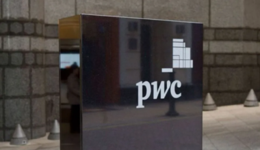 Teneo and PwC New Zealand executives shaking hands to finalize business restructuring unit acquisition deal